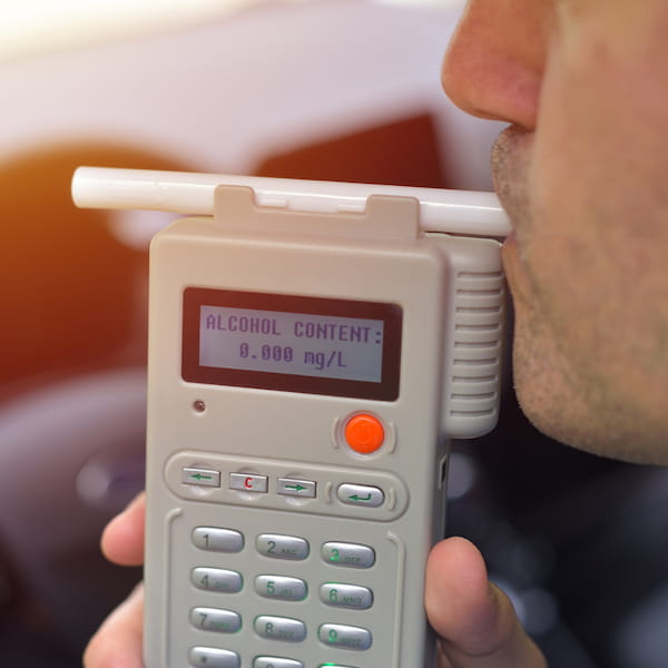 ccg-split-second-mellanby Person blowing into a breathalyzer